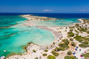 Aerial view of shallow sandy lagoons and a beach surrounded by d Aerial view of Elafonissi Beach